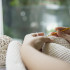 Woman's hands doing home knitting work - people with DIY work at home concept